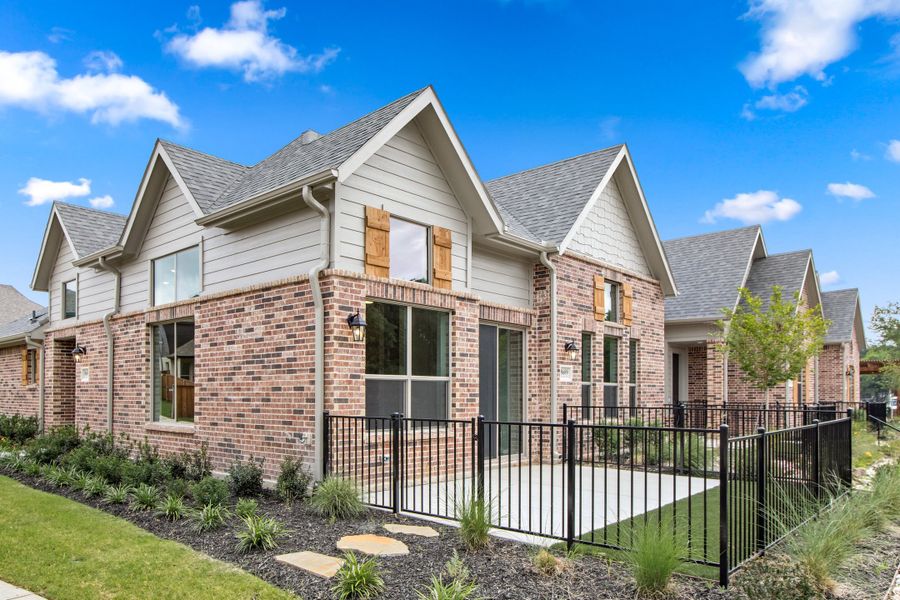 Front exterior of a new home in Cottonwood Creek, Rowlett, TX, highlighting curb appeal (Image 25). Front exterior of a new home in Cottonwood Creek, Rowlett, TX, highlighting curb appeal (Image 25).