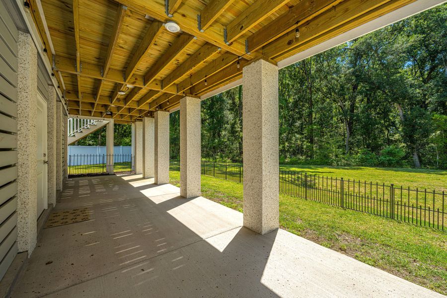 Exterior details and patio area of a home in Overlook at Copahee Sound, Awendaw (Image 28).