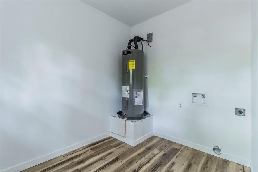 Utilities featuring water heater Utilities featuring water heater