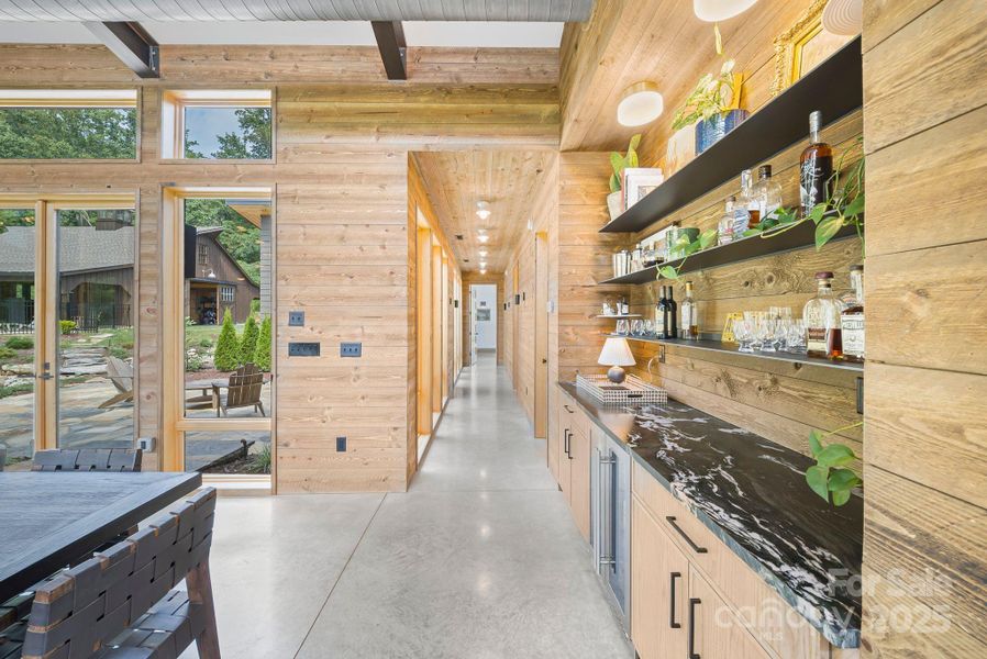 Beautiful built in bar, and ghost wood throughout