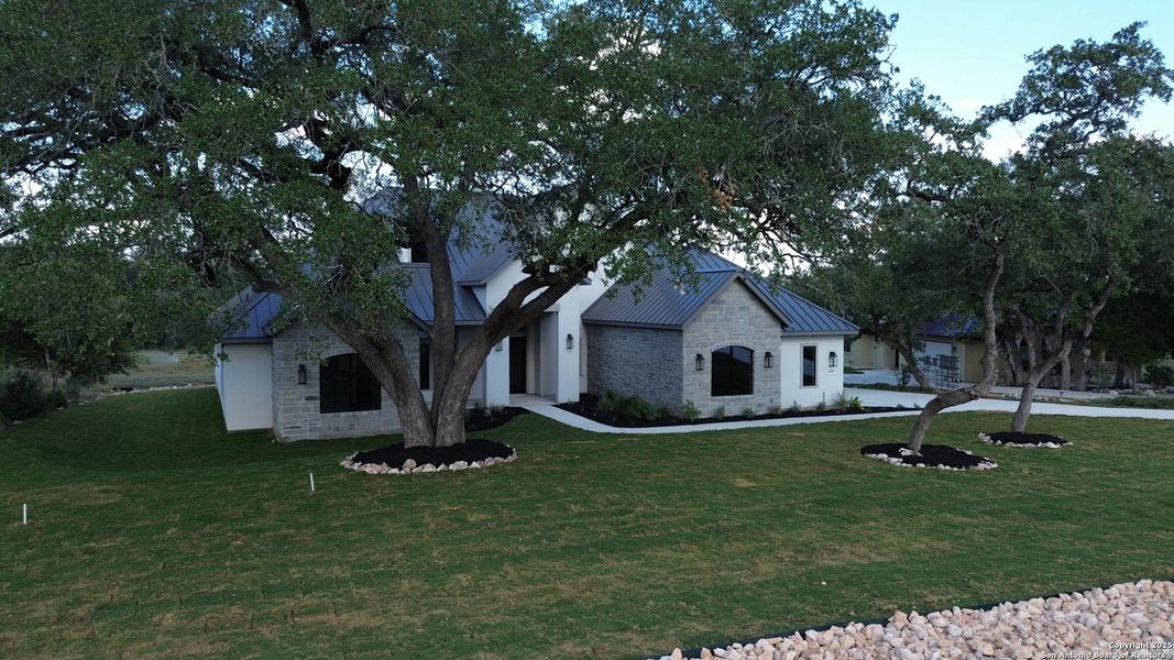 Front exterior of a new home in , New Braunfels, TX, highlighting curb appeal (Image 1).