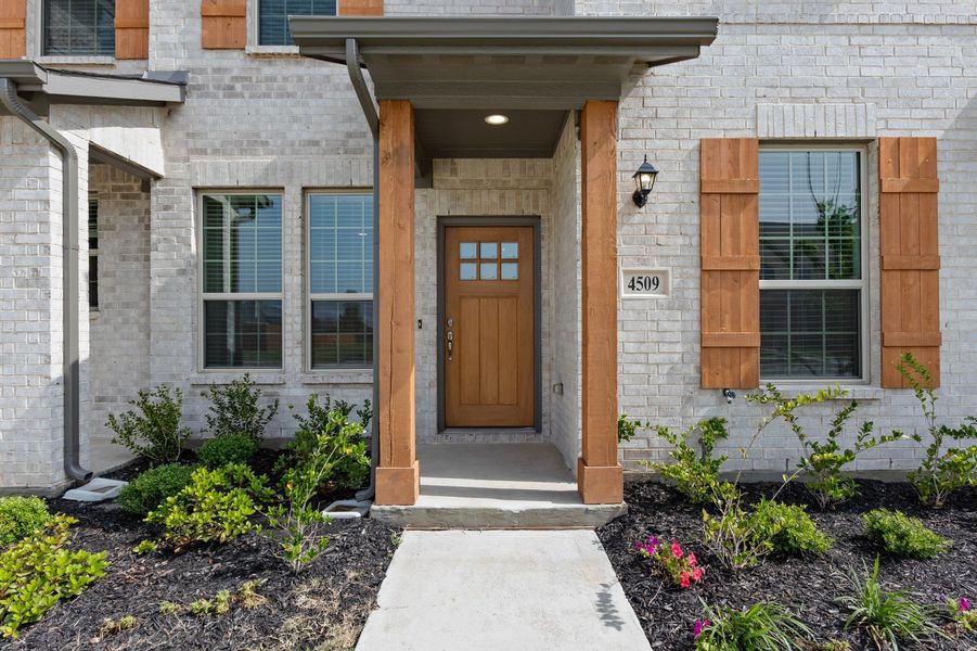 Front exterior of a new home in Sanger Circle – Townhomes, Sanger, TX, highlighting curb appeal (Image 29). Front exterior of a new home in Sanger Circle – Townhomes, Sanger, TX, highlighting curb appeal (Image 29).