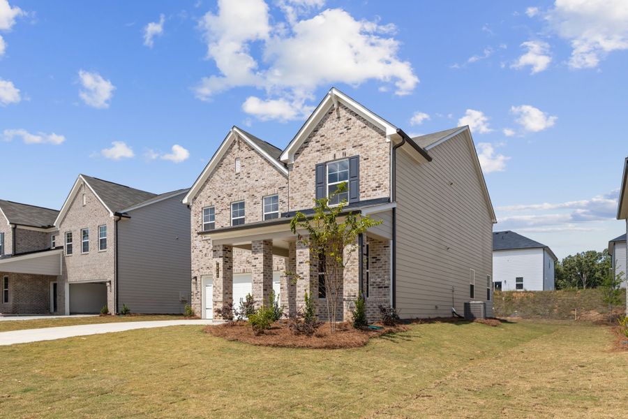 A house with a tree in the front. A house with a tree in the front.
