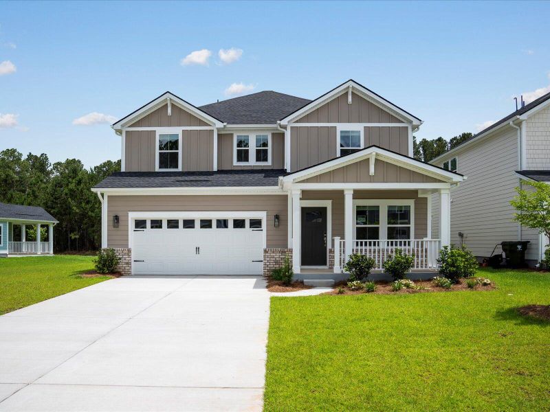 Front exterior of a new home in The Coves at Lakes of Cane Bay, Summerville, SC, highlighting curb appeal (Image 1). Front exterior of a new home in The Coves at Lakes of Cane Bay, Summerville, SC, highlighting curb appeal (Image 1).