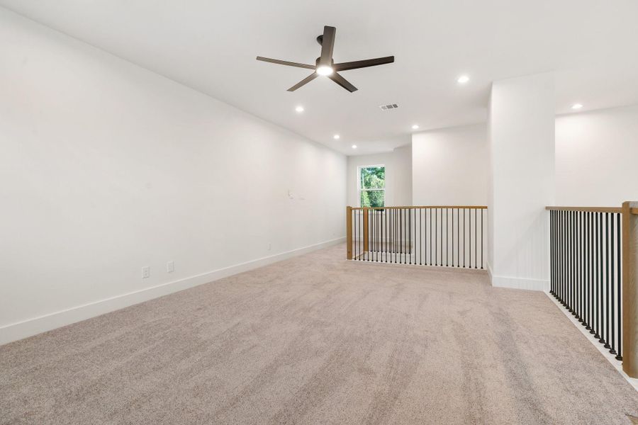 The upstairs family room is bright and spacious, offering a comfortable and versatile space—perfect as a second living area, game room, or cozy retreat for relaxing and gathering. The upstairs family room is bright and spacious, offering a comfortable and versatile space—perfect as a second living area, game room, or cozy retreat for relaxing and gathering.