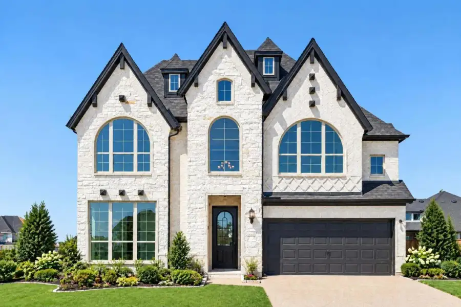 Representative exterior photo of a completed home built from the Grand Providence Estate by Grand Homes in Providence Cove, McKinney, TX (Image 1). Representative exterior photo of a completed home built from the Grand Providence Estate by Grand Homes in Providence Cove, McKinney, TX (Image 1).