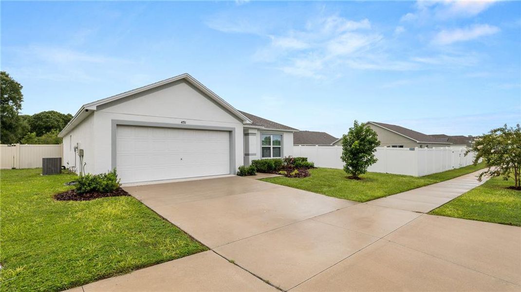 Front exterior of a new home in Gresham Farms Village, Lakeland, FL, highlighting curb appeal (Image 21). Front exterior of a new home in Gresham Farms Village, Lakeland, FL, highlighting curb appeal (Image 21).