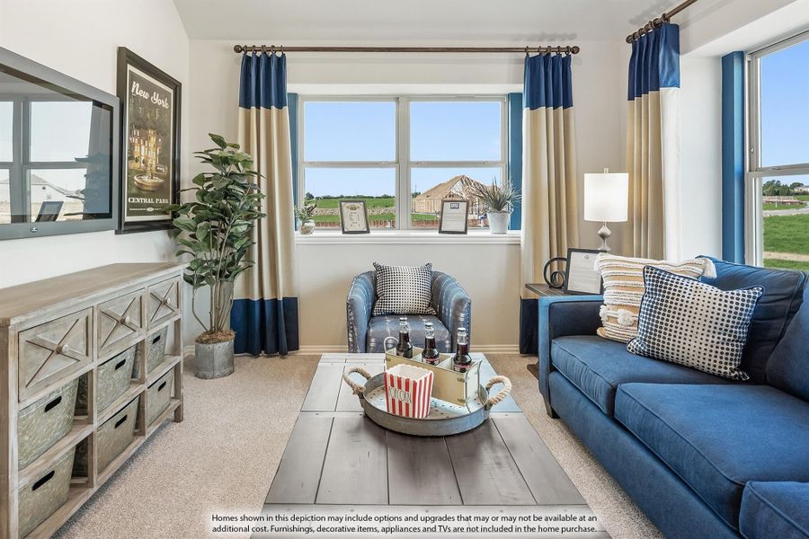 Living room with blue sofa, accent chair, wood coffee table, and large windows with blue and tan curtains Living room with blue sofa, accent chair, wood coffee table, and large windows with blue and tan curtains