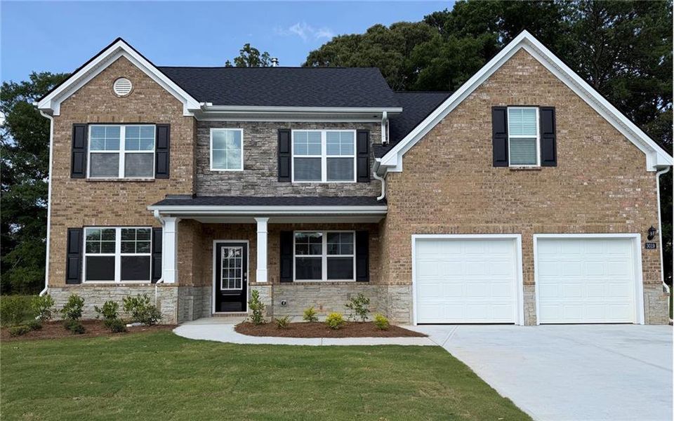 Front exterior of a new home in Independence, Loganville, GA, highlighting curb appeal (Image 1). Front exterior of a new home in Independence, Loganville, GA, highlighting curb appeal (Image 1).