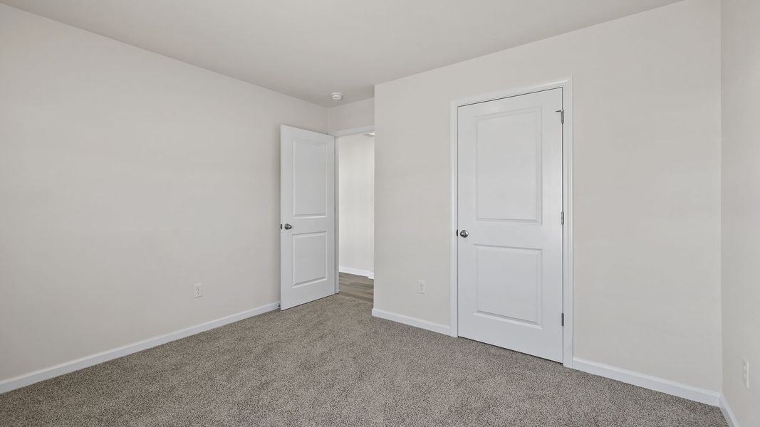 Spacious, unfurnished interior of a new home in Bentley Park, Greenwood (Image 23).