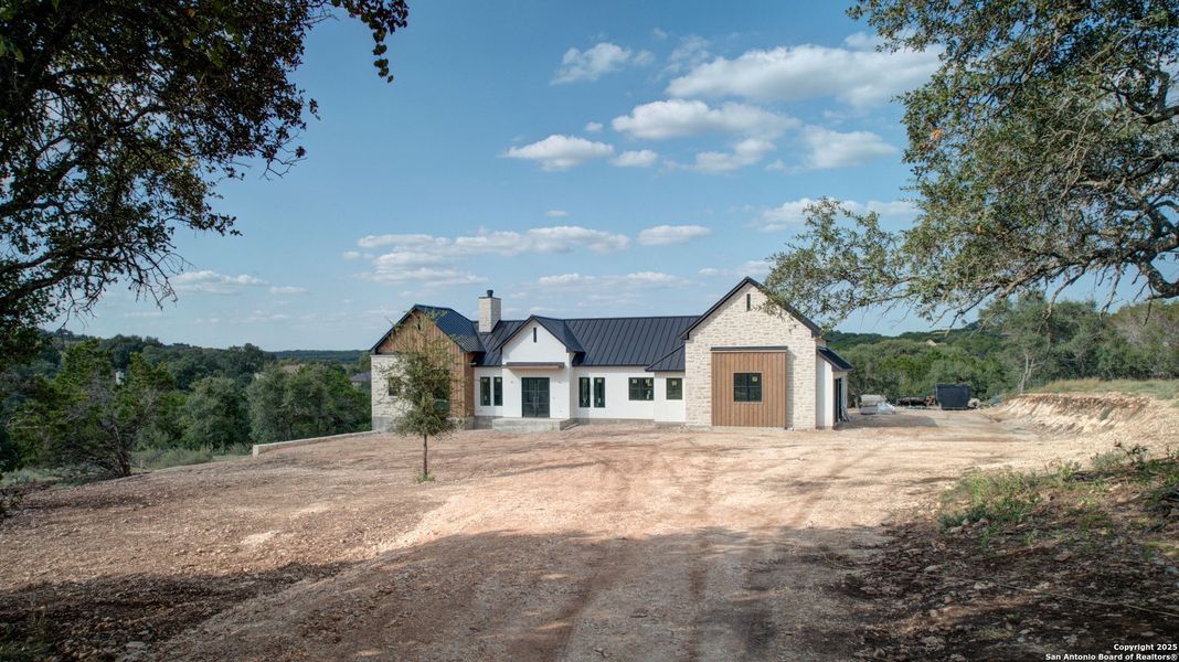 Front exterior of a new home in , New Braunfels, TX, highlighting curb appeal (Image 26). Front exterior of a new home in , New Braunfels, TX, highlighting curb appeal (Image 26).