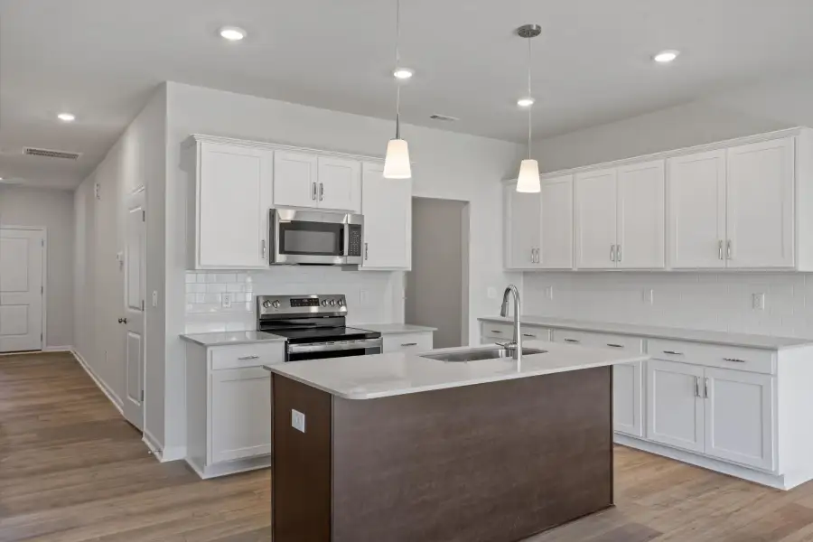 Furnished interior view inside a new home in West Main Townhomes, Sanford (Image 5).