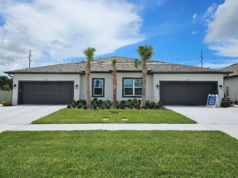 Front exterior of a new home in , Clearwater, FL, highlighting curb appeal (Image 1). Front exterior of a new home in , Clearwater, FL, highlighting curb appeal (Image 1).