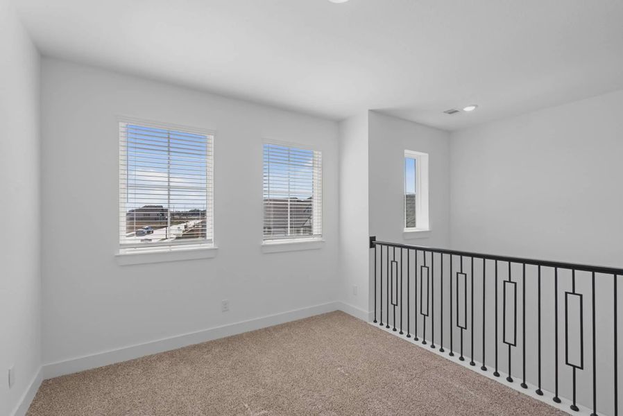 Representative unfurnished interior of a home built from the St Andrews by Chesmar Homes in Riceland Alley Loads, Mont Belvieu (Image 42).