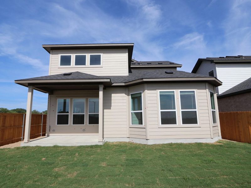 Front exterior of a new home in Estancia West, Manchaca, TX, highlighting curb appeal (Image 19). Front exterior of a new home in Estancia West, Manchaca, TX, highlighting curb appeal (Image 19).