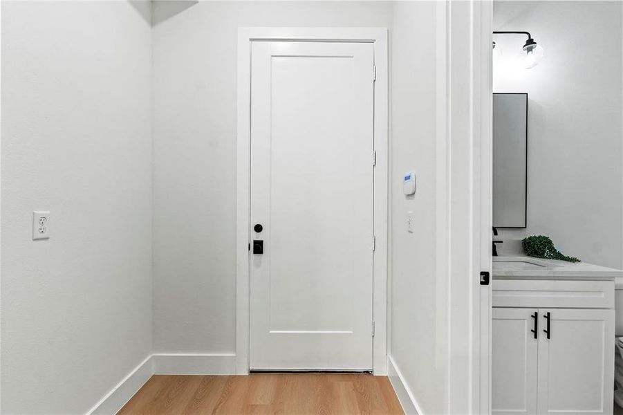 Entryway featuring wood finished floors and baseboards Entryway featuring wood finished floors and baseboards