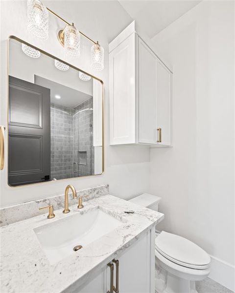 Full bathroom with vanity and a stall shower