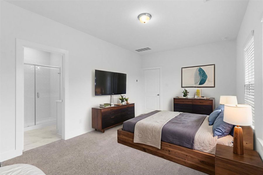Inviting primary suite with multiple windows, soft neutral tones, and ample space for large furnishings, plus direct access to the spa-inspired bath—make this your home, call now! *Virtually Staged*