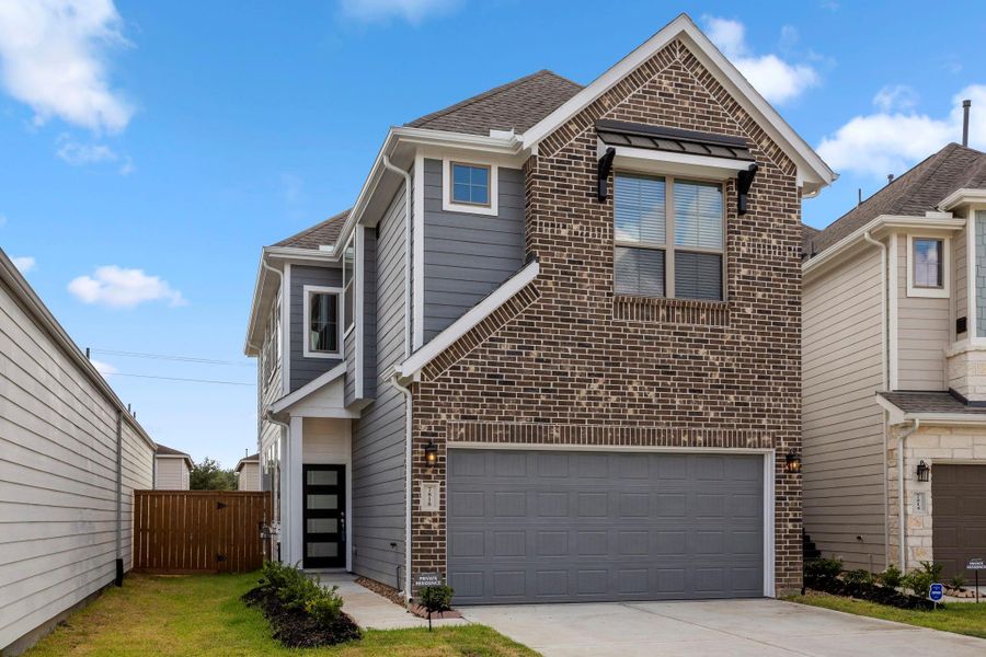 Front exterior of a new home in Marvida, Cypress, TX, highlighting curb appeal (Image 1).