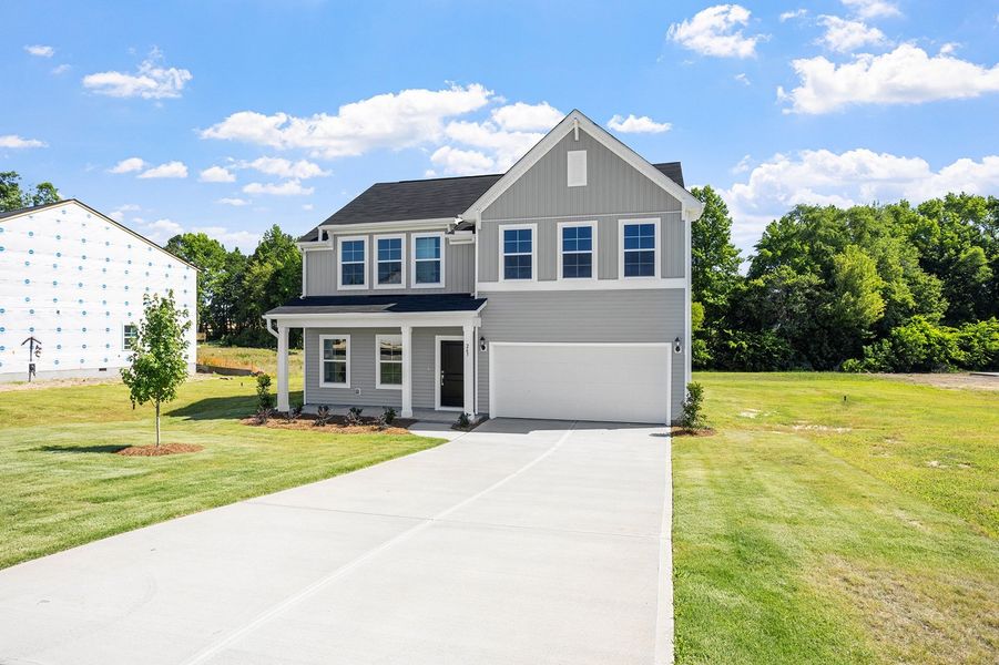 Front exterior of a new home in Cambridge Reserve, Angier, NC, highlighting curb appeal (Image 2). Front exterior of a new home in Cambridge Reserve, Angier, NC, highlighting curb appeal (Image 2).