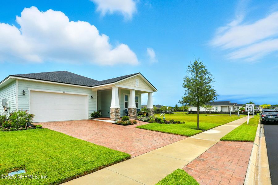 Front exterior of a new home in Reverie at TrailMark, St. Augustine, FL, highlighting curb appeal (Image 1). Front exterior of a new home in Reverie at TrailMark, St. Augustine, FL, highlighting curb appeal (Image 1).