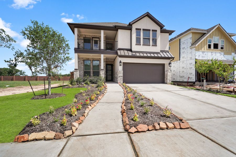 Front exterior of a new home in Brookewater, Rosenberg, TX, highlighting curb appeal (Image 18).