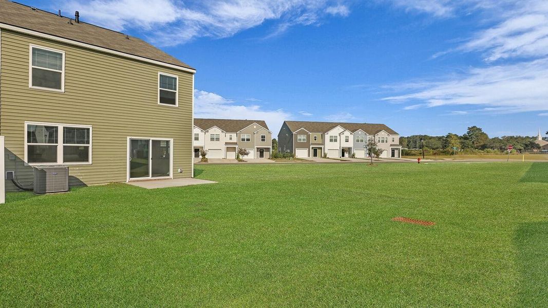 Exterior details and patio area of a home in Carolina Groves Townhomes, Moncks Corner (Image 14).