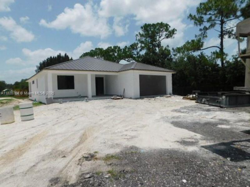 Front exterior of a new home in , Clewiston, FL, highlighting curb appeal (Image 9).