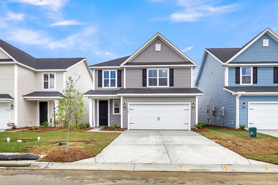 Front exterior of a new home in Cypress Valley, Moncks Corner, SC, highlighting curb appeal (Image 2). Front exterior of a new home in Cypress Valley, Moncks Corner, SC, highlighting curb appeal (Image 2).
