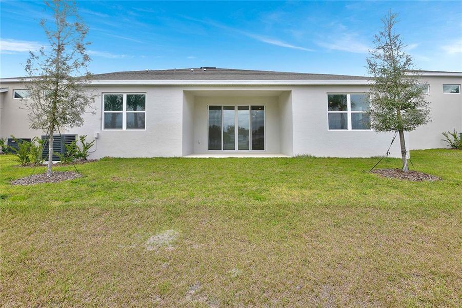 Exterior details and patio area of a home in Seasons at Grandview Gardens, Deland (Image 4).