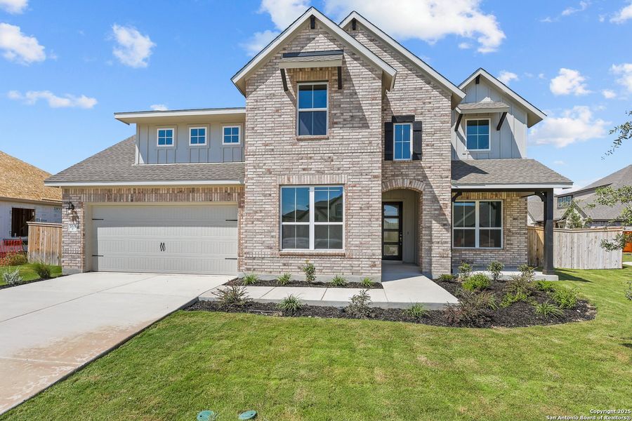 Front exterior of a new home in Megan's Landing 50', Castroville, TX, highlighting curb appeal (Image 2). Front exterior of a new home in Megan's Landing 50', Castroville, TX, highlighting curb appeal (Image 2).