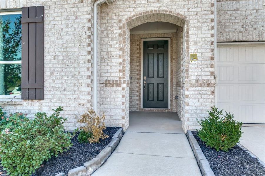 Exterior details and patio area of a home in The Preserve, Justin (Image 18).