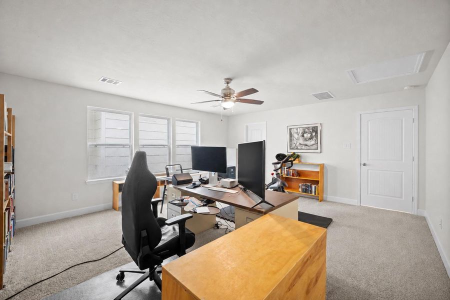 Another angle on the third-floor bedroom shows just how much room there is to work with — this space lives larger than most people expect from a top-floor room. Another angle on the third-floor bedroom shows just how much room there is to work with — this space lives larger than most people expect from a top-floor room.