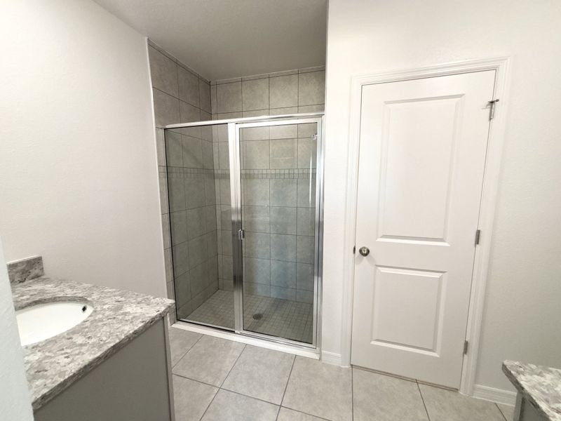 Furnished interior view inside a new home in Lake Deer Estates, Poinciana (Image 9).