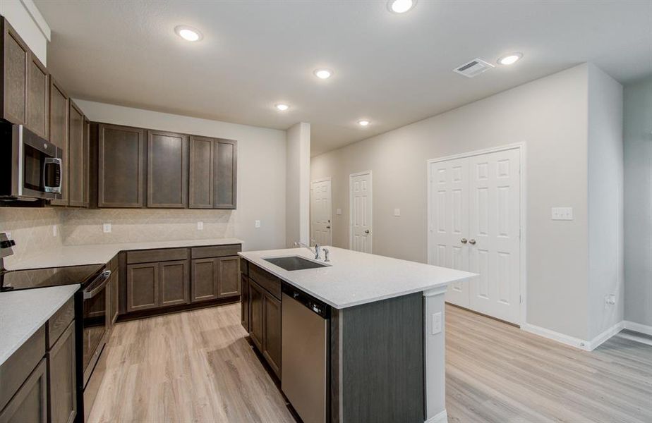 Island kitchen with counter seating