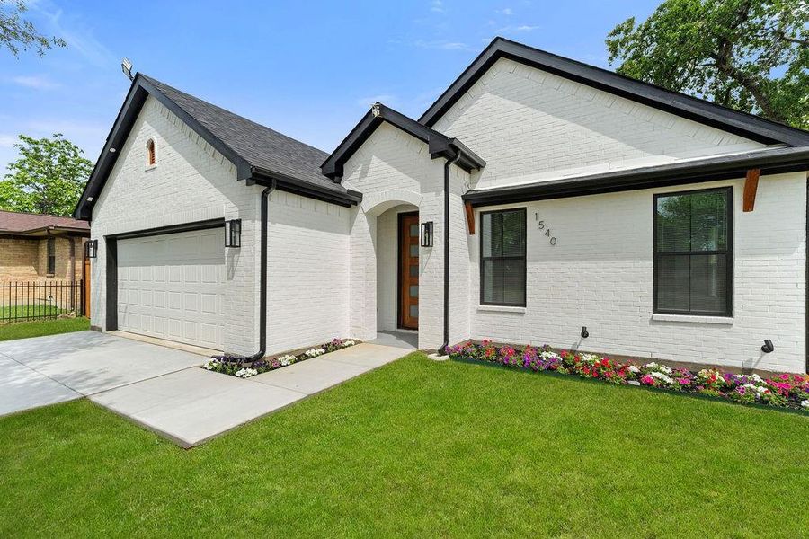 Front exterior of a new home in , Dallas, TX, highlighting curb appeal (Image 21).