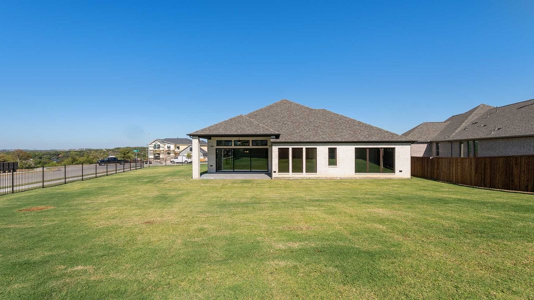 Exterior details and patio area of a home in Talon Hills 60'/70', Fort Worth (Image 3).