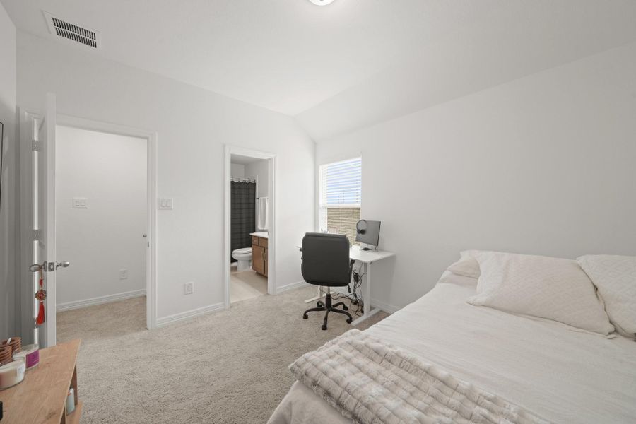 Secondary bedroom with adjoining private bathroom.