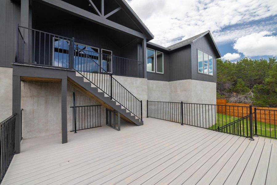 A spacious, multi-level deck offers generous outdoor living space for entertaining.