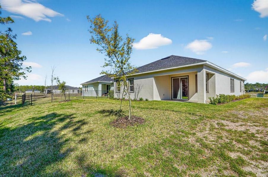 Exterior details and patio area of a home in Gray Hawk at Hole Two, Daytona Beach (Image 4).