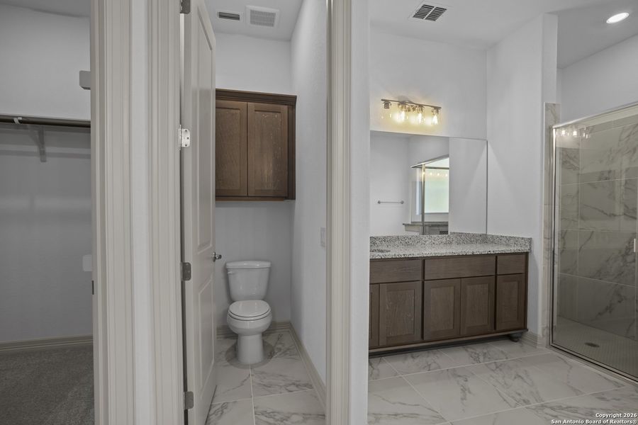 Furnished interior view inside a new home in Highland Estates, San Antonio (Image 11).
