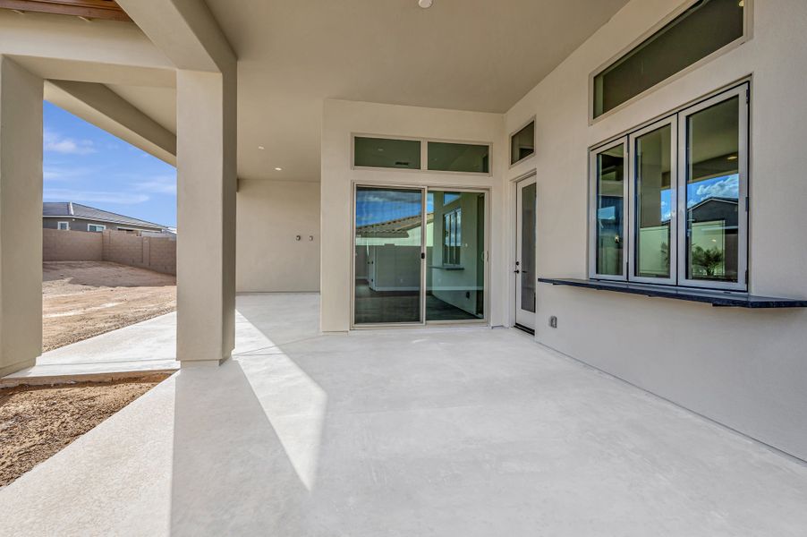 Exterior details and patio area of a home in The Ridge at Victory, Buckeye (Image 3).