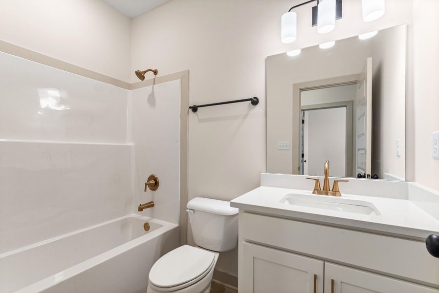 Bathroom with shower / washtub combination and vanity