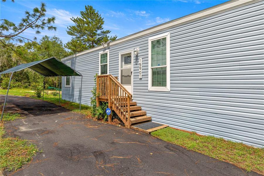 Front exterior of a new home in , Ocklawaha, FL, highlighting curb appeal (Image 16).