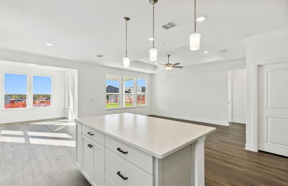 Spacious kitchen with oversized island *real home pictured