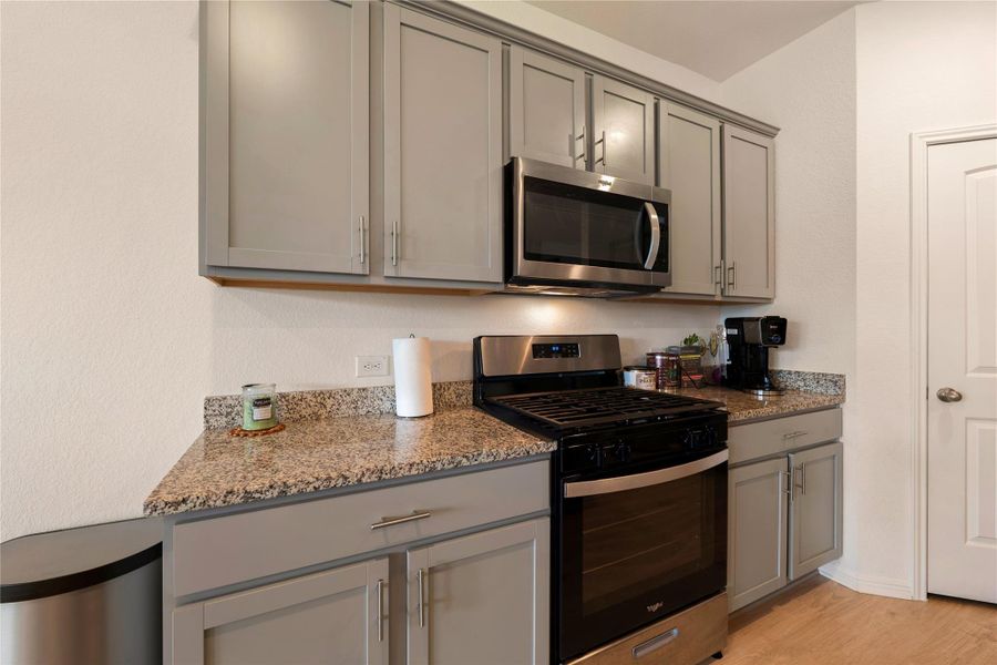 Kitchen featuring granite counters and stainless steel appliances