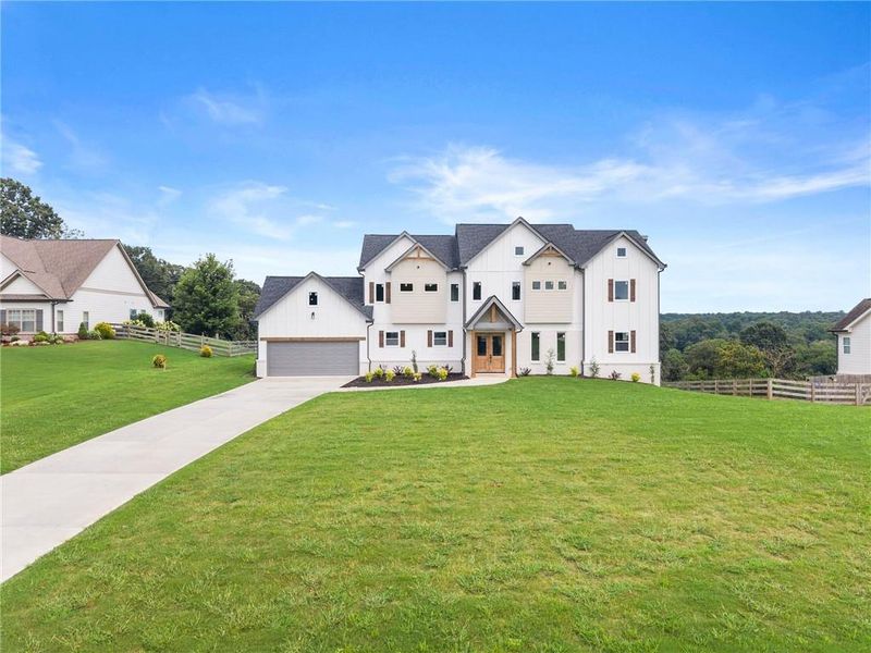 Front exterior of a new home in , Clermont, GA, highlighting curb appeal (Image 25).