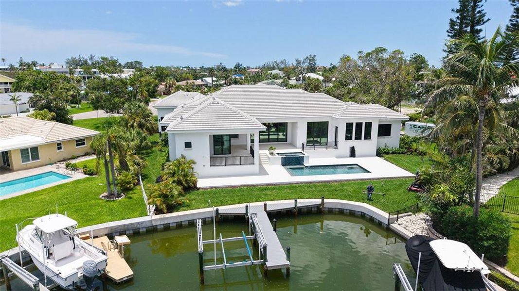 Front exterior of a new home in , Longboat Key, FL, highlighting curb appeal (Image 26).
