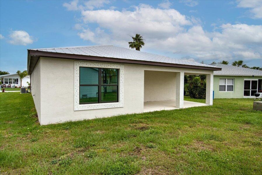 Front exterior of a new home in , Fort Pierce, FL, highlighting curb appeal (Image 1). Front exterior of a new home in , Fort Pierce, FL, highlighting curb appeal (Image 1).