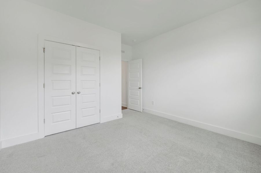 Spacious, unfurnished interior of a new home in McAlister Creek, Clayton (Image 27).